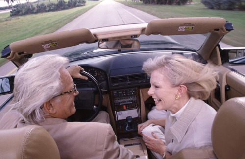 boomer couple in convertible