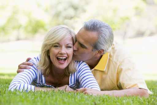 Boomer Couple lying the ground