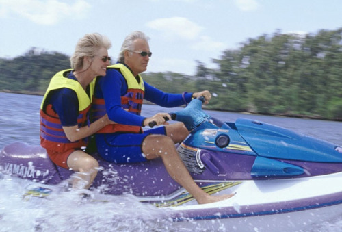 Boomer Couple riding a skidoo